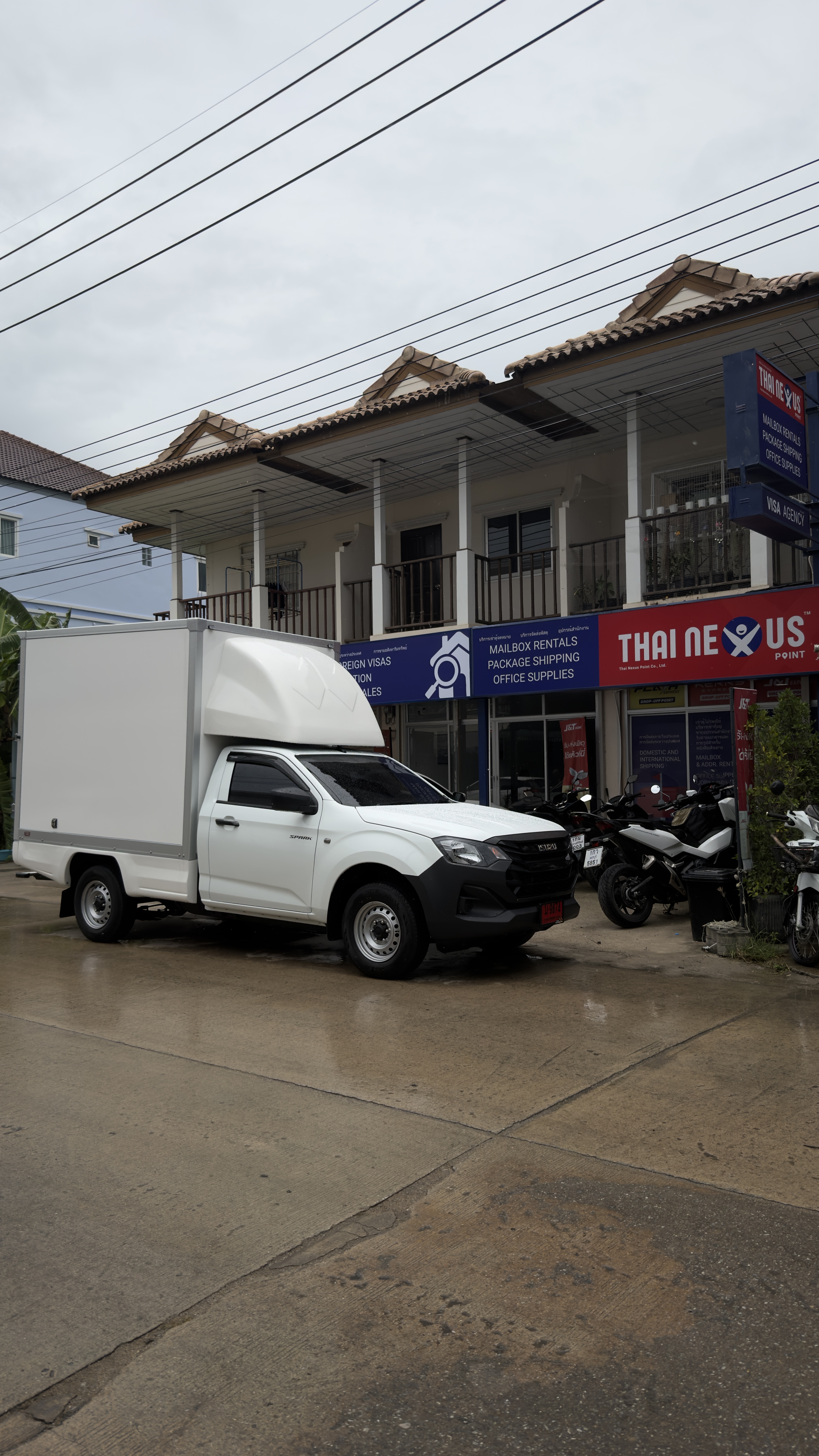 Thai Nexus Point shopfront and delivery truck in Hua Hin