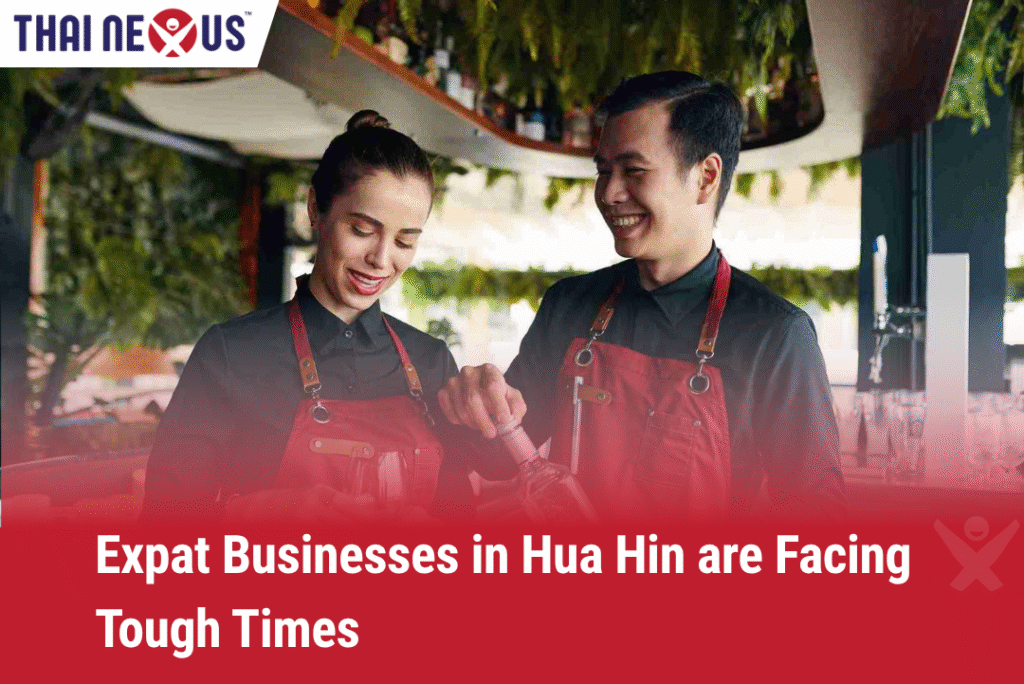 Smiling expat business owners working behind a bar in Hua Hin, Thailand, highlighting the human side of tourism downturn impacts