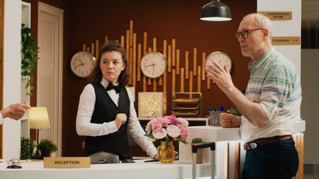 A Hotel receptionist in hua hin arguing with a guest about refused package from lazada